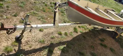 14' Lund aluminum fishing boat, comes with a 9.9 Johnson motor that runs with feul tank and ez loade...