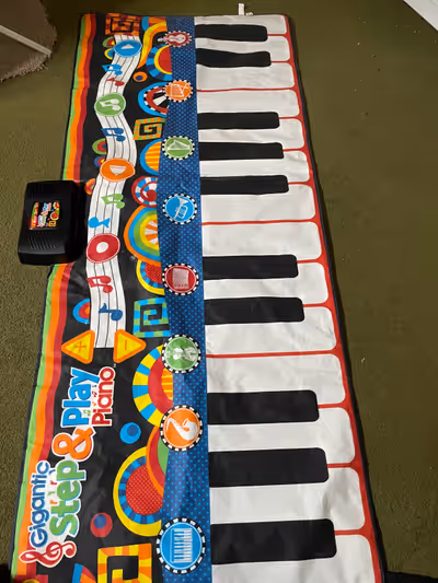 Baby piano toy. Makes noises.