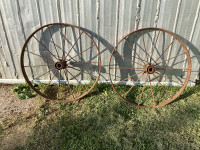 Two antique steel wheels