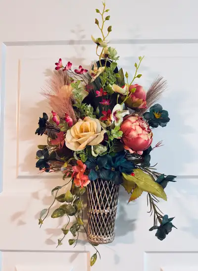 This is one of my newest floral arrangements featuring pink, cream, teal and burgundy tones, set in...