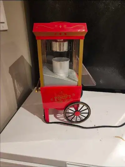 Get ready for movie night with this charming Nostalgia popcorn machine! This unit has been well care...