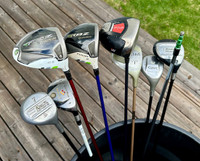 Various Golf Clubs and Head Covers.