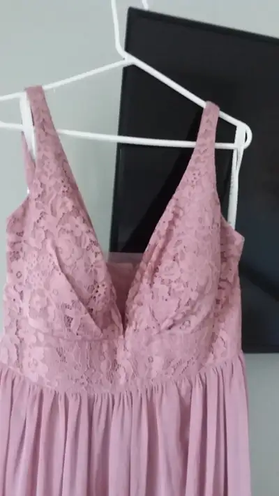 Selling a vintage mauve colour dress. It was a size 18 and brought into a size 17. There is also a l...