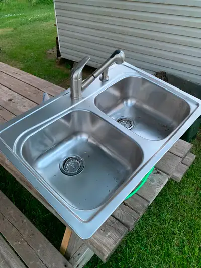 Never used kitchen sink and faucet., View more