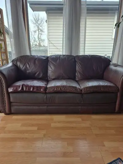 Well used couch and loveseat.
