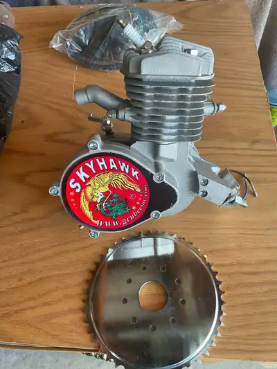 Skyhawk GT5A bicycle engine 66CC-2.0KW brand new extra parts in sealed bag . Sold as is. Pickup only...