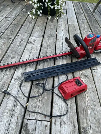 For sale Toro cordless hedge trimmer. 24volt battery. 24” blade. Tool works great. Battery charger d...