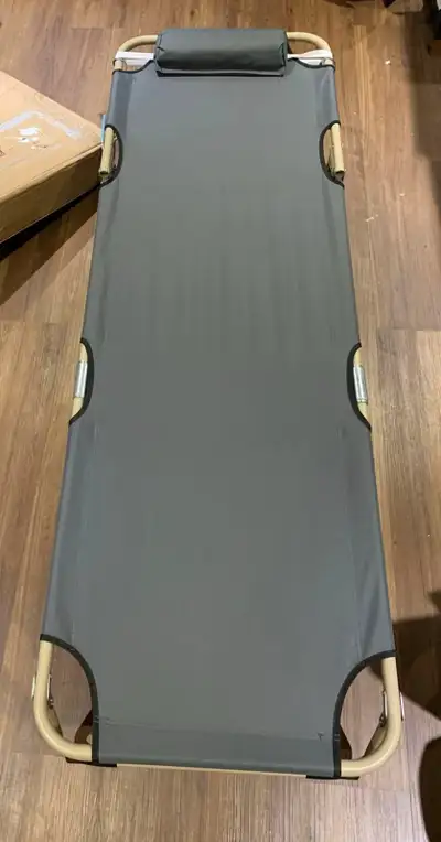 Relax in comfort with this brand new in box portable folding cot bed, perfect for camping or as an e...