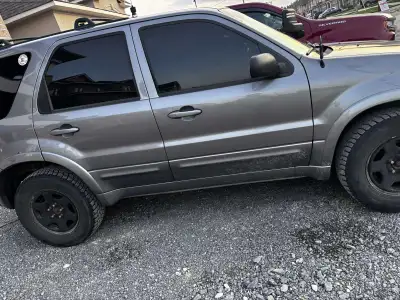 This is a grey 2007 Ford Escape Limited, ready for its next adventure! Being a used vehicle, it has...