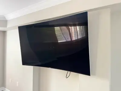65” curved Samsung smart TV., View more