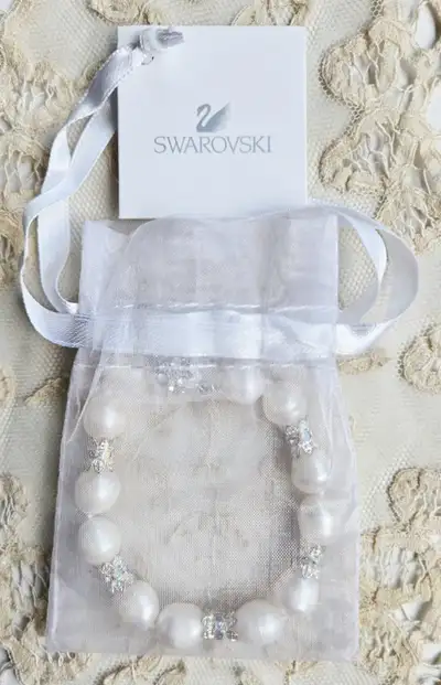 "SWOROVSKI" CRYSTAL AND SERENITY PEARL BRACELET, View more