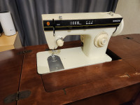 Vintage Singer Sewing Machine Model 3102 with Pedal and Cabinet