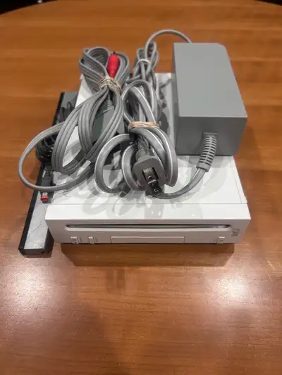 Nintendo Wii RVL-001 console with all OEM cables, power supply, av & sensor bar. Console turns on an...