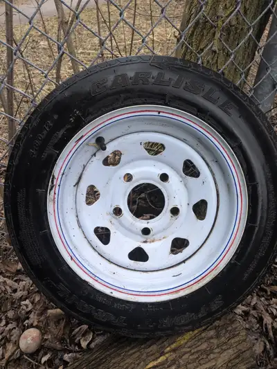 Used as a spare, never installed on trailer (see tread pictures), 5 on 4-1/2 in. bolt pattern, 4-ply...