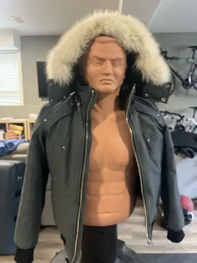 Dark grey / black jacket with white fur.