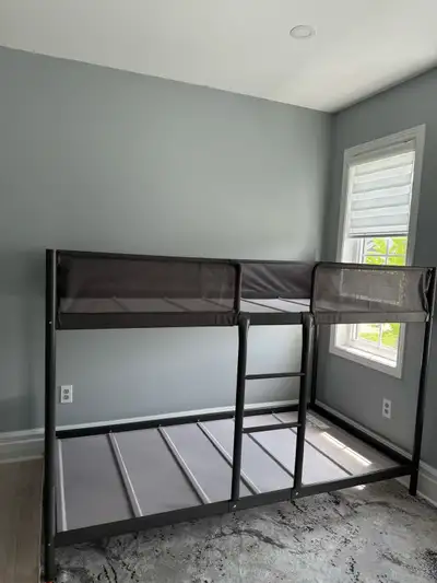 This is a used IKEA metal bunk bed frame, perfect for kids or small spaces. It's in good condition a...