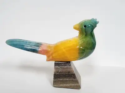 Vintage carved onyx statute of an adorable bird sitting on an angular onyx base and looking back ove...