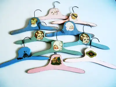 ANTIQUE CHILDS WOODEN PAINTED CLOTHES HANGERS, View more