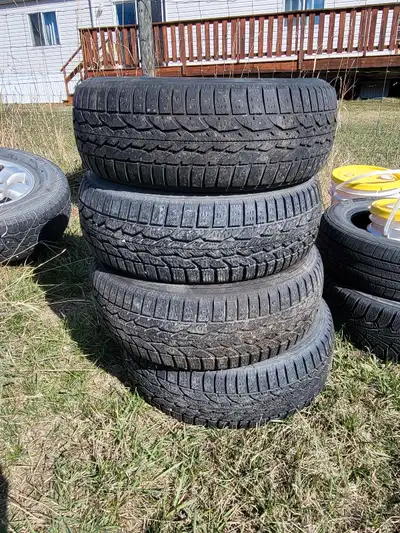 New Firestone winter force 215 55 r16 tires with mountain and snowflake , only use for one winter. T...