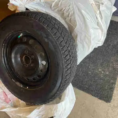 Blizzak winter tires on rims set of 4 215/70 R16 New last year, used for one season with minimal KMS...