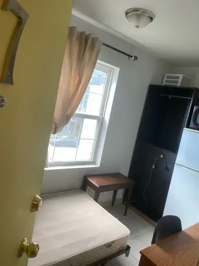 Very small studio room in the top of the old building with no elevator , near Center Street 16 Ave N...