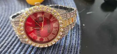 Add a touch of bling to your wrist with this iced-out, faux Rolex-style custom watch, a real head-tu...