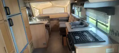 Hybrid camper for sale, no papers, floor has couple of soft spots, stove ,fridge,furnace and air con...