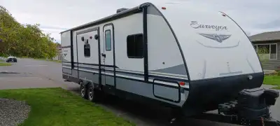 Forest River Model # 285 IKLE. Features a double slide out with Island kitchen Queen size bed Heatin...