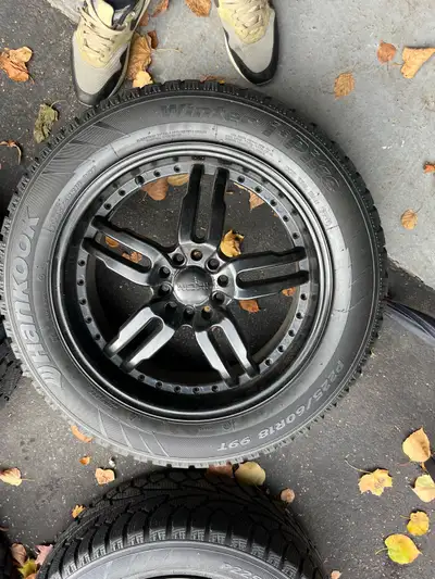 Selling 4 aluminum rims 18 inch with old winter tires hankook these are multi parameter one rim is d...
