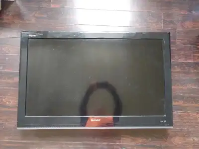 Sharp 42" LCD Tv with Wall mount. *Speakers are blown needs external speaker*, Bluetooth works)