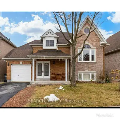 Welcome Home! This fabulous detached bungalow offers a rare walk-out basement with a private separat...