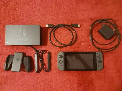Nintendo Switch comes with 1 left joy-con 1 right joy-con 2 joy-con attachments 1 joy-con holder 1 c...