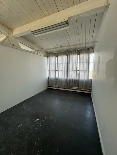 Private studio space in larger shared unit with other artists (no one passing through, visible or wo...