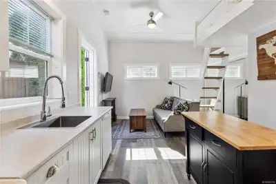 The suite is in a separate building from the house. Very private. Hardwood flooring. Ideal for a mat...