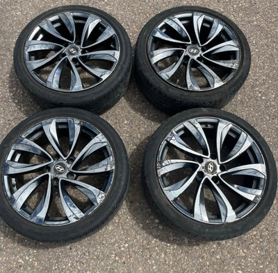 199 FIRM I have 4 matching Huyndai 18 inch rims on 4 matching racing Pirelli very low profile tires...