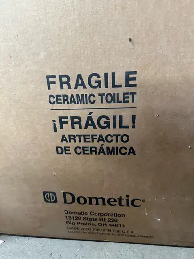 Brand new in box Dometic RV toilet. Can be used with composting systems requiring low flush toilet.