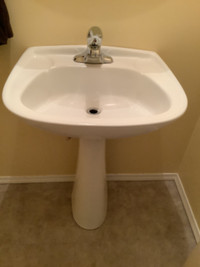White Pedestal sink with faucet tap