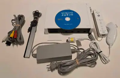 Nintendo Wii with Wii Sports (disc only). This Console can also play GameCube games. Tested and work...
