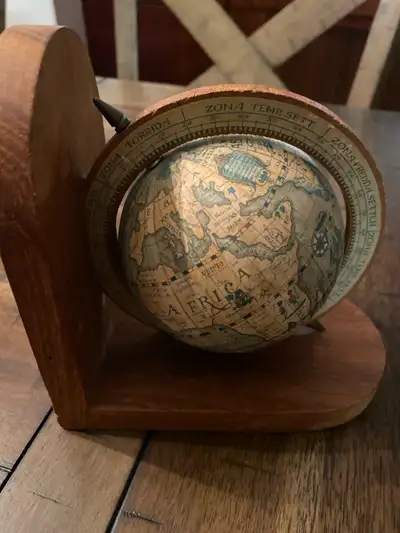 Add a touch of vintage charm to your decor with this used decorative globe featuring old-world carto...