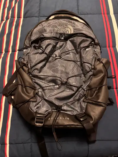 Like New. The North Face Borealis Daypack offers versatile storage with an innovative bungee cord sy...