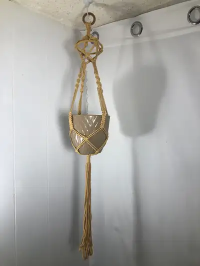 Tan Macrame & Tan Pot. NEW 6” plastic pot Approximately 30” long Brand New $20 Cash or E-transfer Ce...