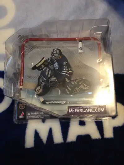 For sale McFarlane NHL Curtis Joseph Toronto Maple Leafs hockey figure. This is the "Logo bottle"ver...