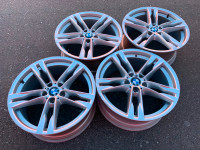 Set of Genuine factory F12 6 series 20" style 373 rims good cond
