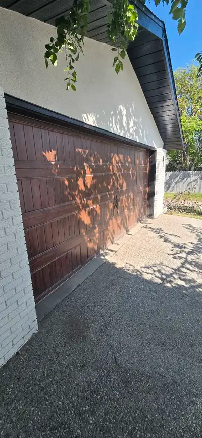 16 x 7 Brown garage door as pictured. In great condition and works flawlessly. The lift master opene...