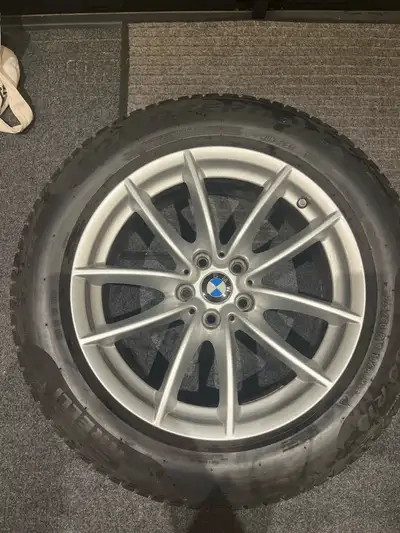 Selling a full set of 4 OEM BMW rims with mounted winter tires. Came off my BMW X5. Perfect if you w...