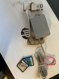 Nintendo DS charger and two games 
