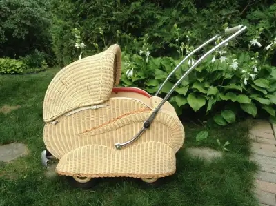 This beautiful vintage baby carriage is in very good condition. The wicker is sturdy vinyl. It was o...