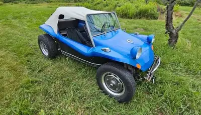Take a joy ride in this striking blue 1959 VW Dune Buggy, a classic convertible ready for adventure!...