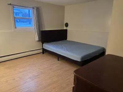This is a room for rent, featuring a bed, and dresser. The room is currently available for couple or...