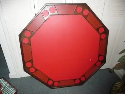 Eight position poker/games table. 48" across. Vinyl top. Legs fold for storage. Good condition.